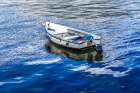 White rowboat in harbor, Dartmouth, Devon, England. Art Print